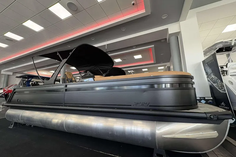 The Image of 2026 Viaggio Z24B pontoon boat displayed in a modern showroom. - 0