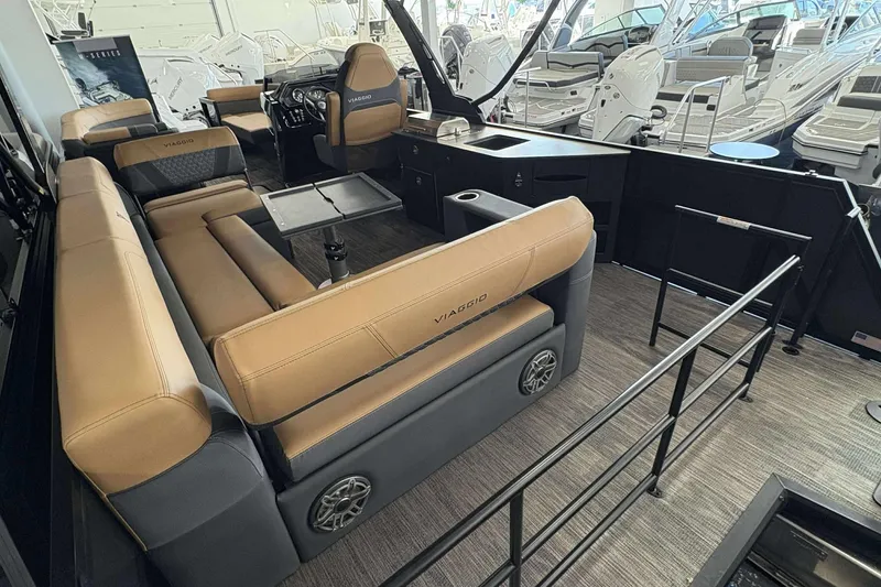 Slide: The Image of Luxurious interior of 2026 Viaggio Z24B boat with tan seating and modern amenities. - 12