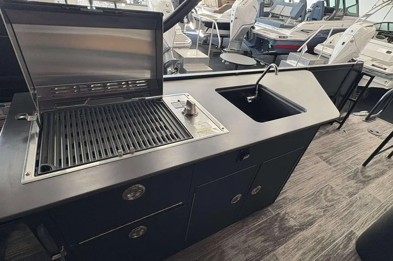 Slide: The Image of Outdoor kitchen setup on Viaggio Z24B 2026 model boat, featuring grill and sink. - 4