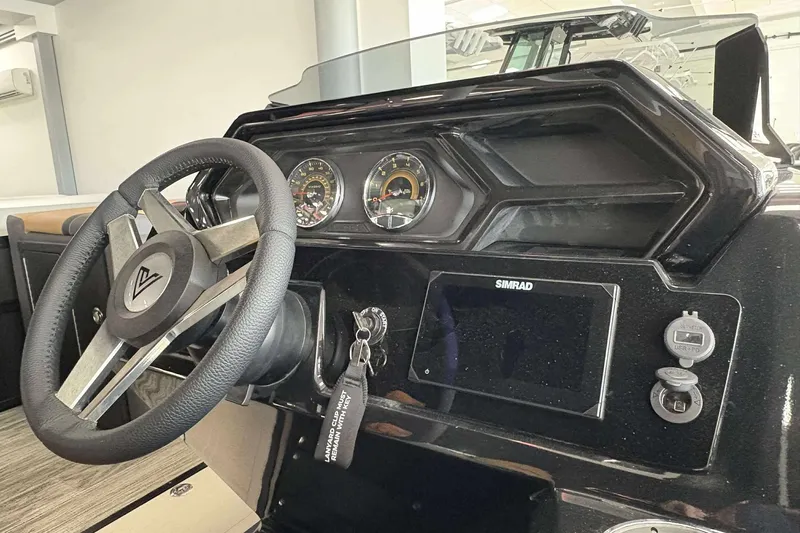 Slide: The Image of Steering wheel and dashboard of 2026 Viaggio Z24B boat with Simrad display. - 8
