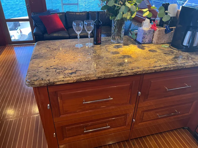 Slide: The Image of Luxurious Hatteras 60 yacht interior with granite countertop and elegant wooden cabinetry, year 2000. - 3