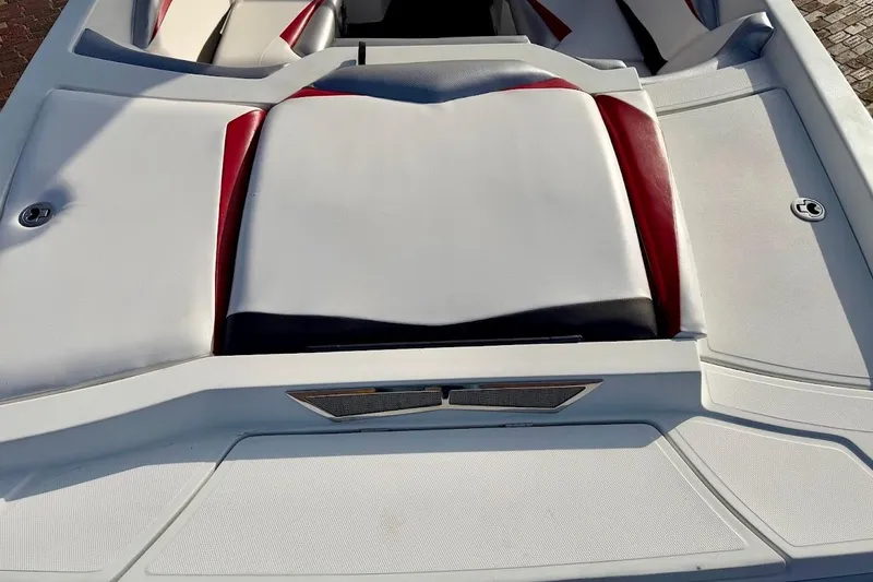 Slide: The Image of 2012 Tigé R20 boat interior with white and red seating. - 10