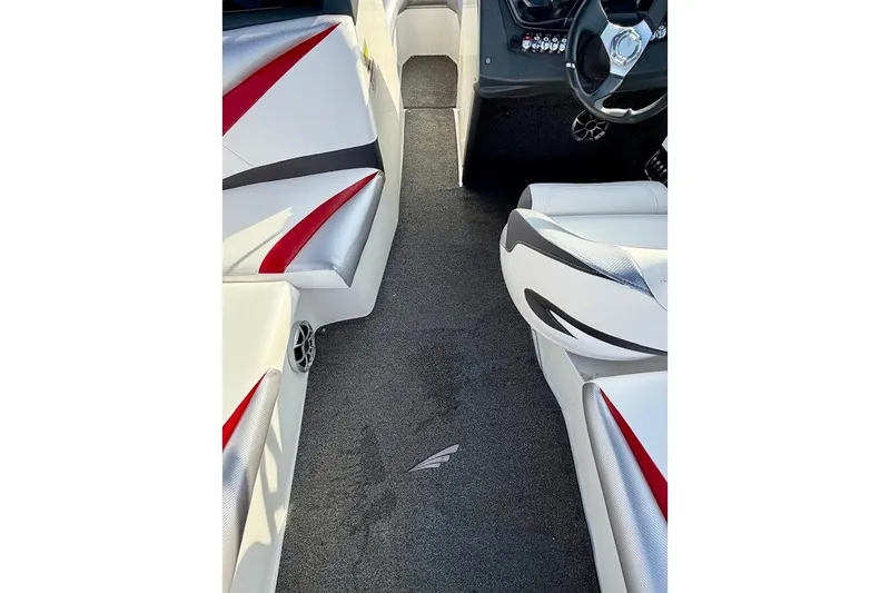 Slide: The Image of Interior of 2012 Tigé R20 boat with stylish seating and steering wheel. - 12