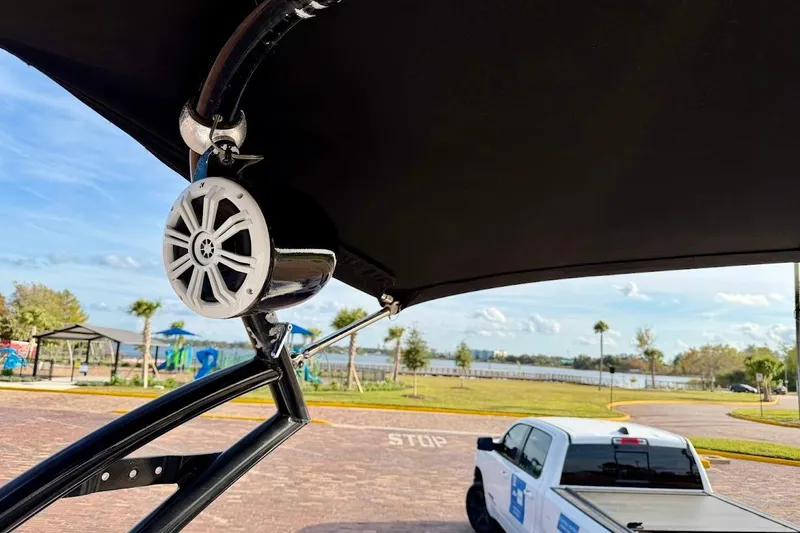 Slide: The Image of 2012 Tigé R20 boat speaker with scenic park and lake view in background. - 31