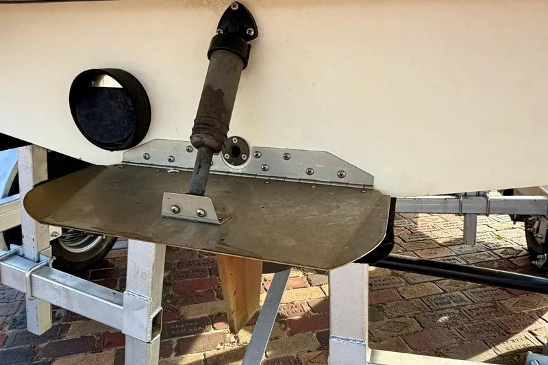 Slide: The Image of 2012 Tigé R20 boat trailer with propeller guard and hydraulic components. - 8