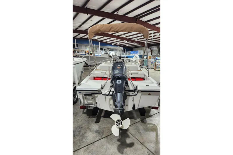 Slide: The Image of 2024 Edgewater 158CS boat with outboard motor in a showroom. - 3