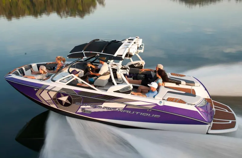 Slide: The Image of 2014 Nautique Super Air Nautique G23 boat in front of California Custom store. - 1