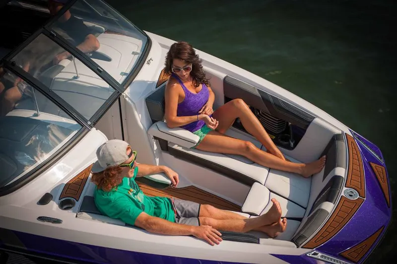 Slide: The Image of 2014 Nautique Super Air Nautique G23 boat in vibrant green on a trailer. - 4