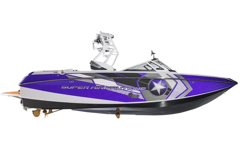 Slide: The Image of 2014 Nautique Super Air Nautique G23 boat on trailer, green and gray design. - 6