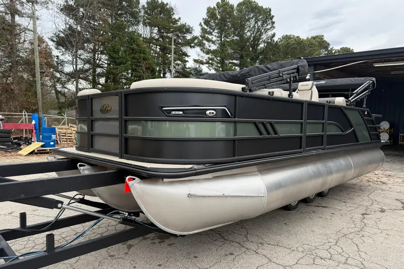 The Image of 2026 Bentley Pontoons Elite 223 Swingback on trailer, parked outdoors. - 0