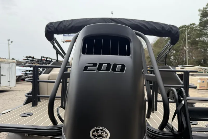 Slide: The Image of 2026 Bentley Pontoons Elite 223 Swingback with 200 HP engine, docked outdoors. - 13