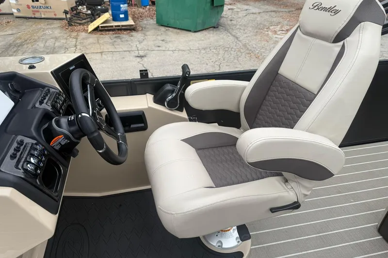 Slide: The Image of 2026 Bentley Pontoons Elite 223 Swingback captain's chair and steering console. - 6