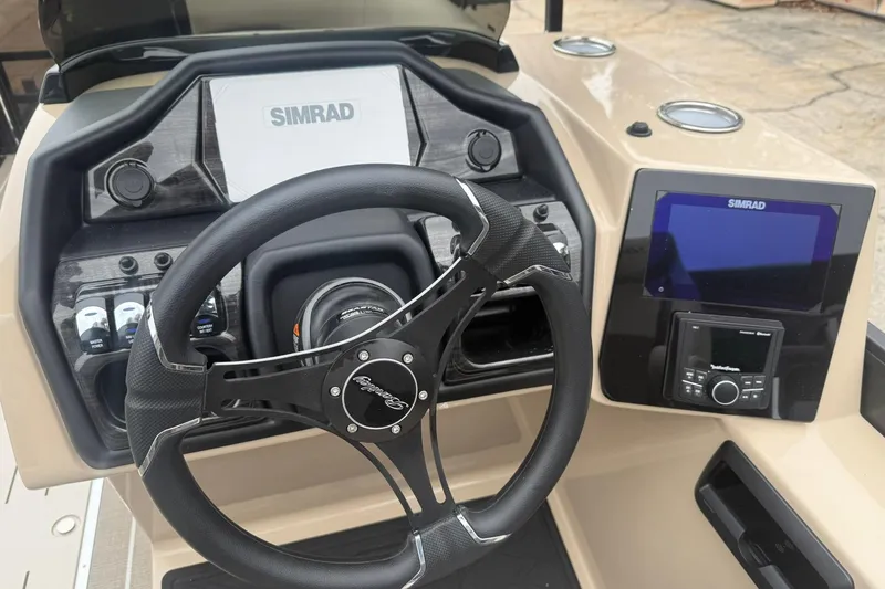 Slide: The Image of 2026 Bentley Pontoons Elite 223 Swingback dashboard with Simrad navigation system and steering wheel. - 7