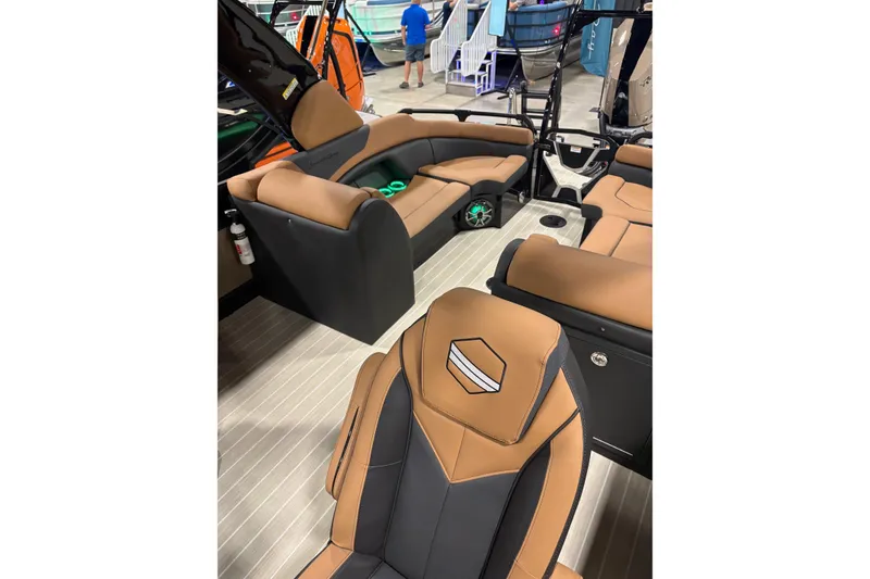 Slide: The Image of 2026 South Bay Sport RS9 DC boat interior with tan and black seating. - 7