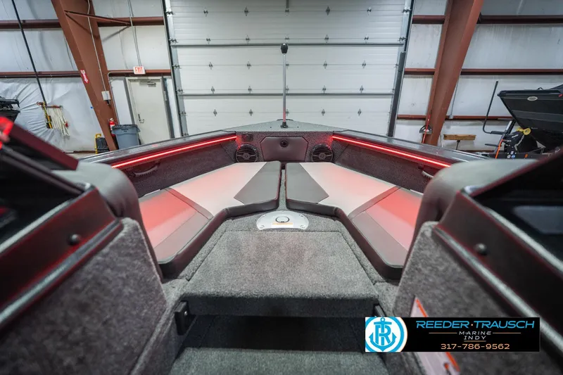 Slide: The Image of 2026 Lund 1875 Crossover XS boat interior with modern seating and sleek design. - 18