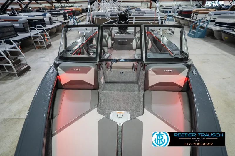 Slide: The Image of 2026 Lund 1875 Crossover XS boat interior with seating and red LED lighting. - 19