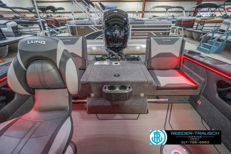 Slide: The Image of 2026 Lund 1875 Crossover XS boat interior with seating and storage compartments. - 21