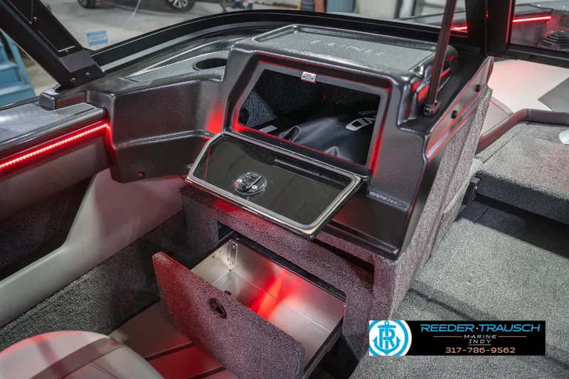 Slide: The Image of 2026 Lund 1875 Crossover XS boat interior with open storage compartment. - 25