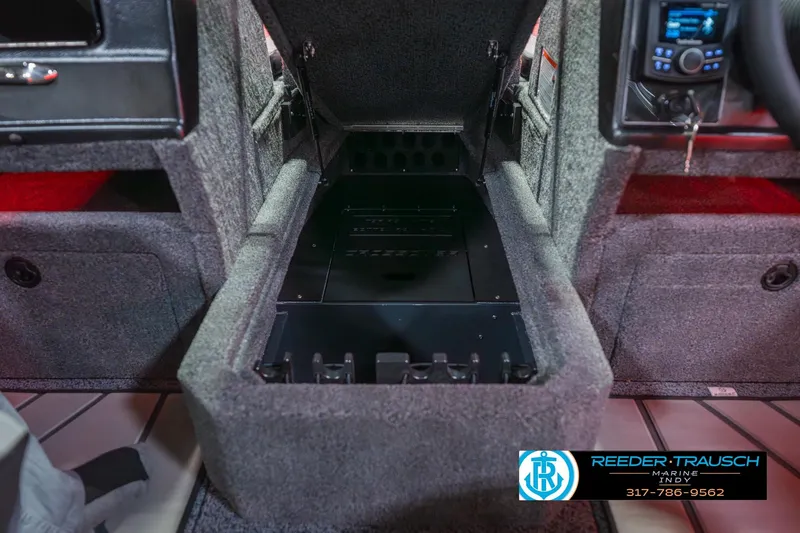 Slide: The Image of Interior of 2026 Lund 1875 Crossover XS boat with red LED lighting and carpeted flooring. - 27