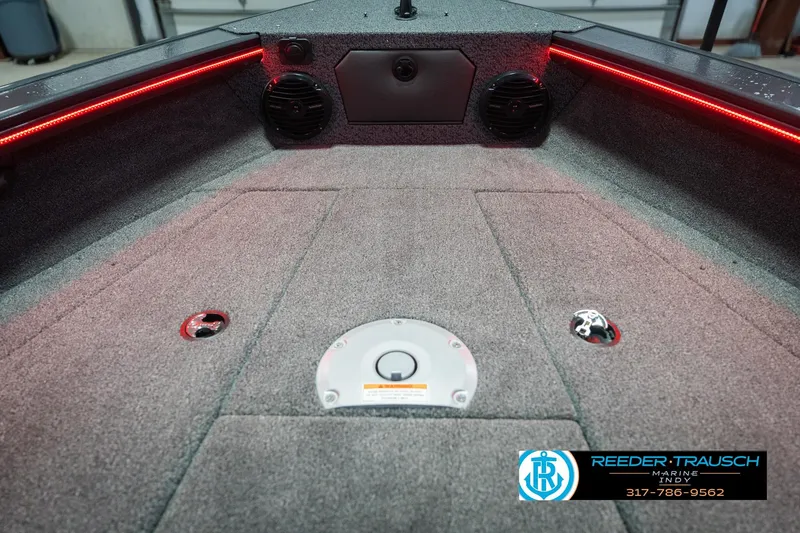 Slide: The Image of 2026 Lund 1875 Crossover XS boat dashboard with steering wheel and gauges. - 29