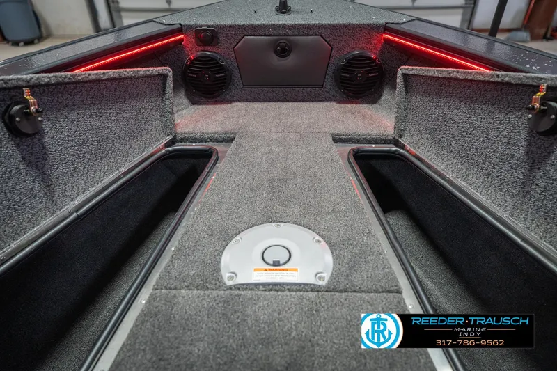 Slide: The Image of Interior view of 2026 Lund 1875 Crossover XS boat with modern steering wheel and dashboard. - 30