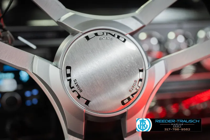 Slide: The Image of Dashboard of 2026 Lund 1875 Crossover XS boat with fuel, trim, and RPM gauges. - 33