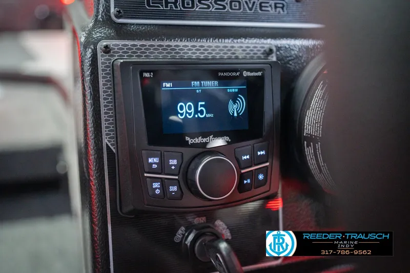 Slide: The Image of Control panel of 2026 Lund 1875 Crossover XS boat with various toggle switches. - 34