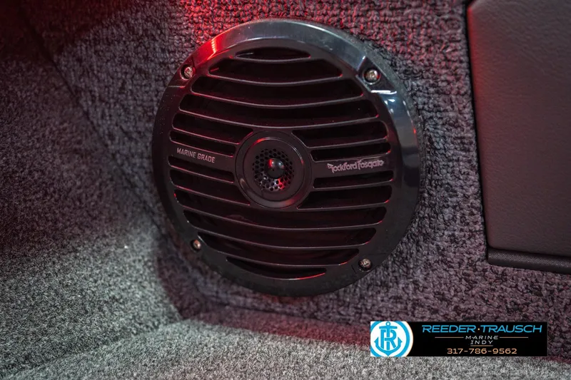 Slide: The Image of 2026 Lund 1875 Crossover XS interior with red LED lighting and carpeted storage. - 43