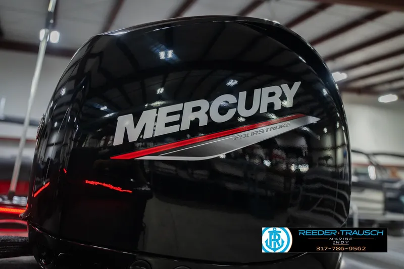 Slide: The Image of 2026 Lund 1875 Crossover XS boat in showroom with Reeder-Trausch Marine logo. - 48