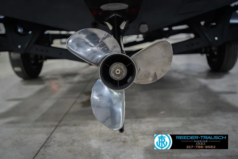 Slide: The Image of 2026 Lund 1875 Crossover XS boat, sleek design with bold graphics. - 51