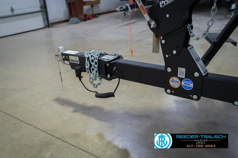 Slide: The Image of 2026 Lund 1875 Crossover XS trailer wheel, black alloy rim, Reeder-Trausch Marine logo. - 54