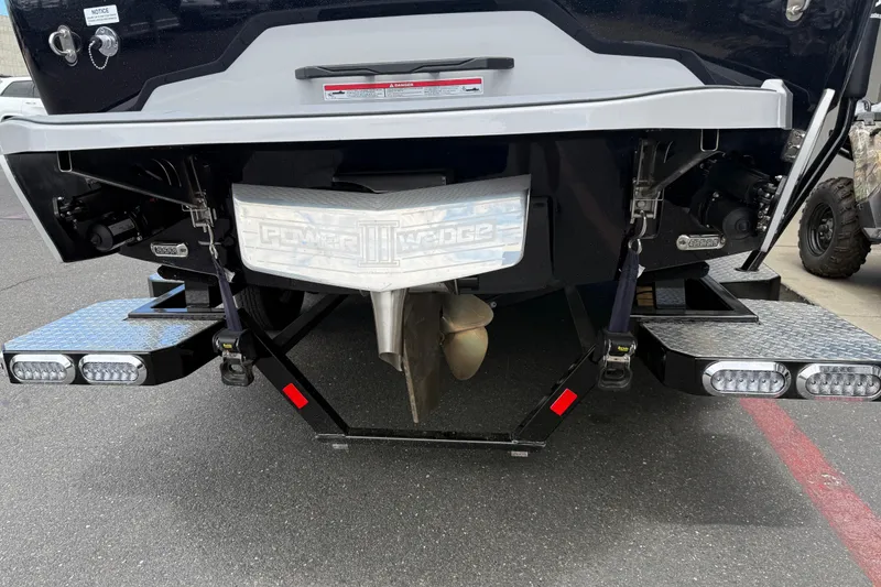 Slide: The Image of Rear view of 2023 Axis A24 boat with propeller and platform details. - 12