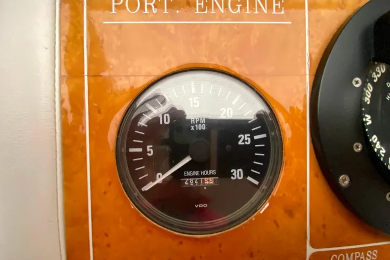 Slide: The Image of RPM gauge of 2001 Compass 57 boat, showing engine hours. - 20