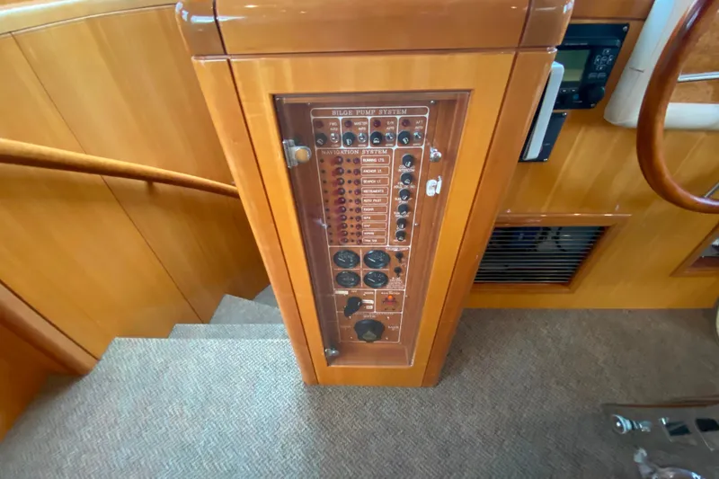 Slide: The Image of Control panel on a 2001 Compass 57 yacht, featuring bilge pump system. - 25