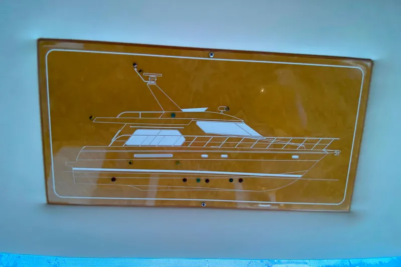Slide: The Image of Diagram of a 2001 Compass 57 yacht on a wooden plaque. - 28