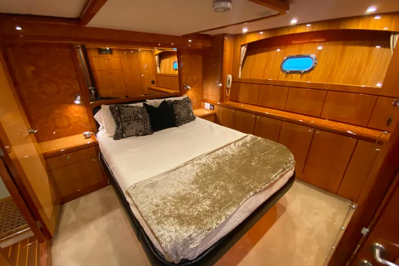 Slide: The Image of Luxurious bedroom interior of 2001 Compass 57 yacht with elegant wood finish and cozy bedding. - 32