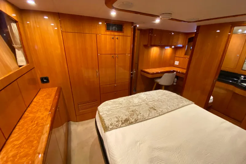 Slide: The Image of Luxurious wooden interior of 2001 Compass 57 yacht cabin with bed and desk. - 34