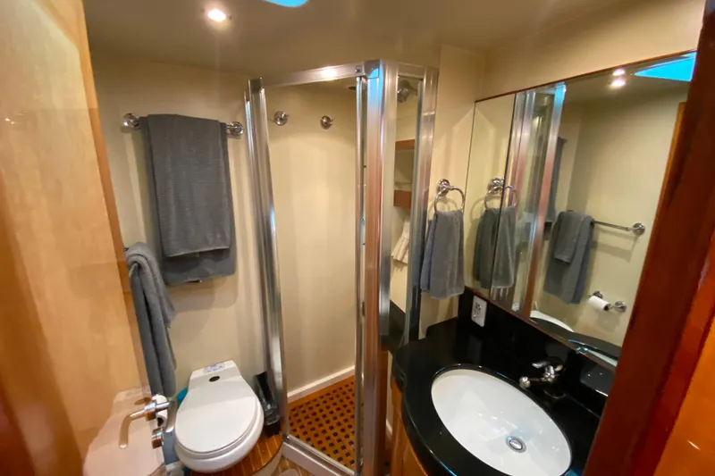 Slide: The Image of Luxurious bathroom in 2001 Compass 57 yacht with modern fixtures and elegant design. - 45