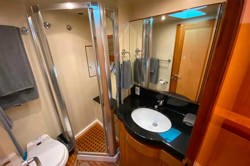 Slide: The Image of Luxurious bathroom in 2001 Compass 57 yacht with modern fixtures and elegant design. - 46