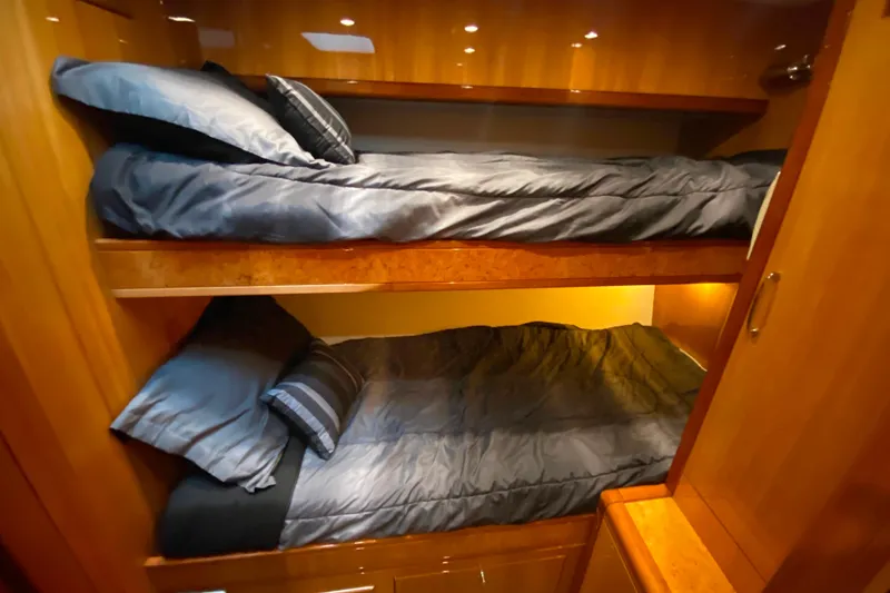 Slide: The Image of Bunk beds in a 2001 Compass 57 yacht cabin with wooden interior. - 47