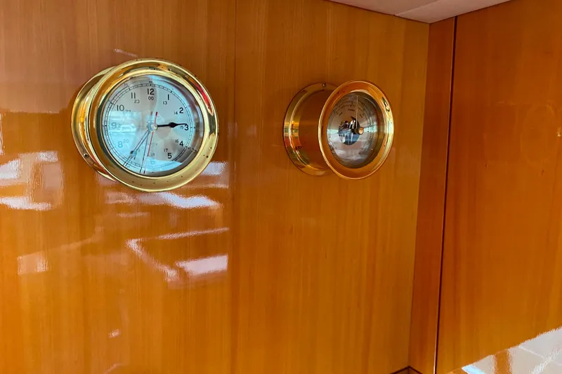 Slide: The Image of Gold nautical clock and barometer on polished wooden panel, Compass 57, 2001 model. - 50