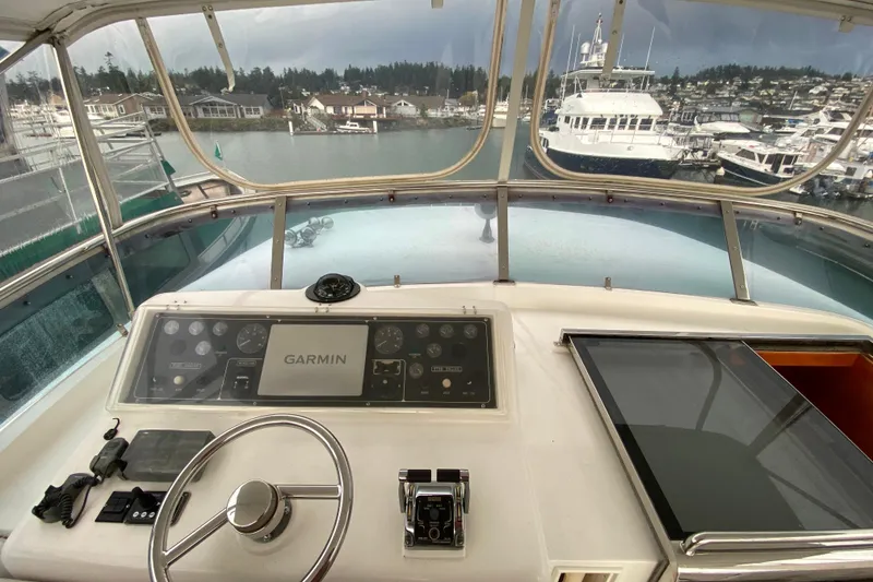 Slide: The Image of Cockpit view of 2001 Compass 57 yacht with Garmin navigation system at marina. - 52
