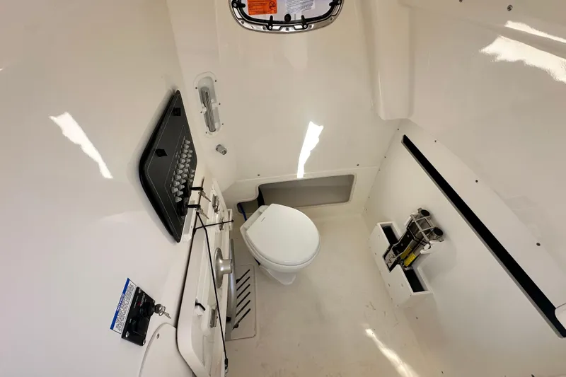 Slide: The Image of Interior of 2026 Boston Whaler 280 Outrage with toilet. - 15