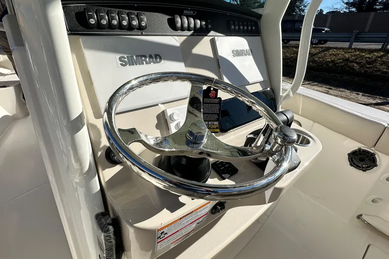 Slide: The Image of Boston Whaler 280 Outrage 2026 helm with Simrad technology. - 19