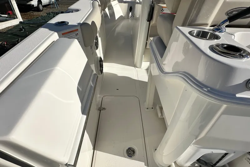 Slide: The Image of Interior of 2026 Boston Whaler 280 Outrage with seating and cup holders. - 22