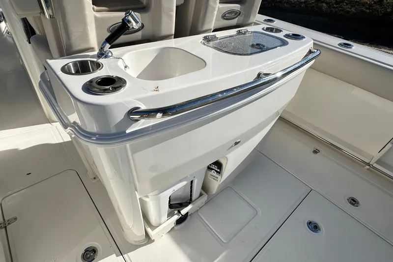 Slide: The Image of Boston Whaler 280 Outrage 2026, boat kitchenette with sink and storage. - 23