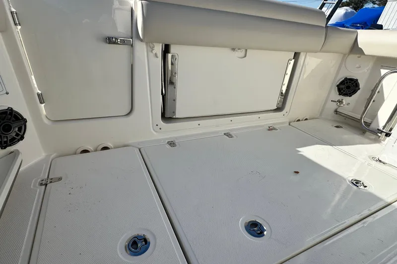 Slide: The Image of Interior of 2026 Boston Whaler 280 Outrage with storage and speakers. - 25
