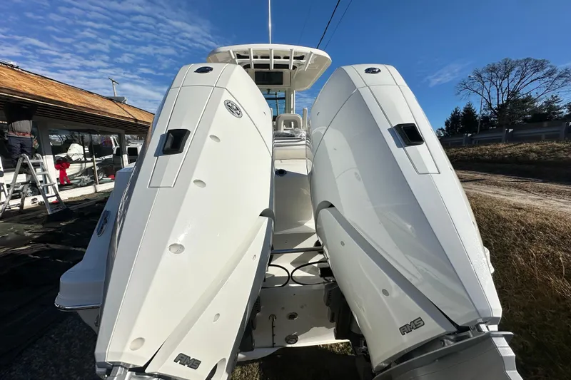 Slide: The Image of 2026 Boston Whaler 280 Outrage with dual outboard engines. - 27