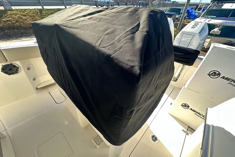Slide: The Image of Boston Whaler 280 Outrage 2026 with cover outdoors. - 28