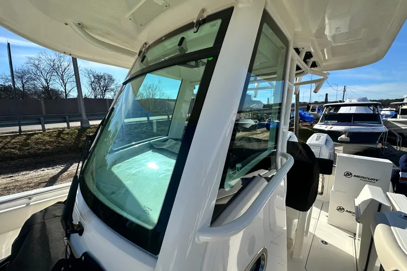 Slide: The Image of 2026 Boston Whaler 280 Outrage with Mercury engines at the dock. - 29